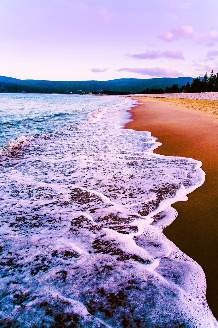 Waves meet the shore on Ingonish Beach, NS